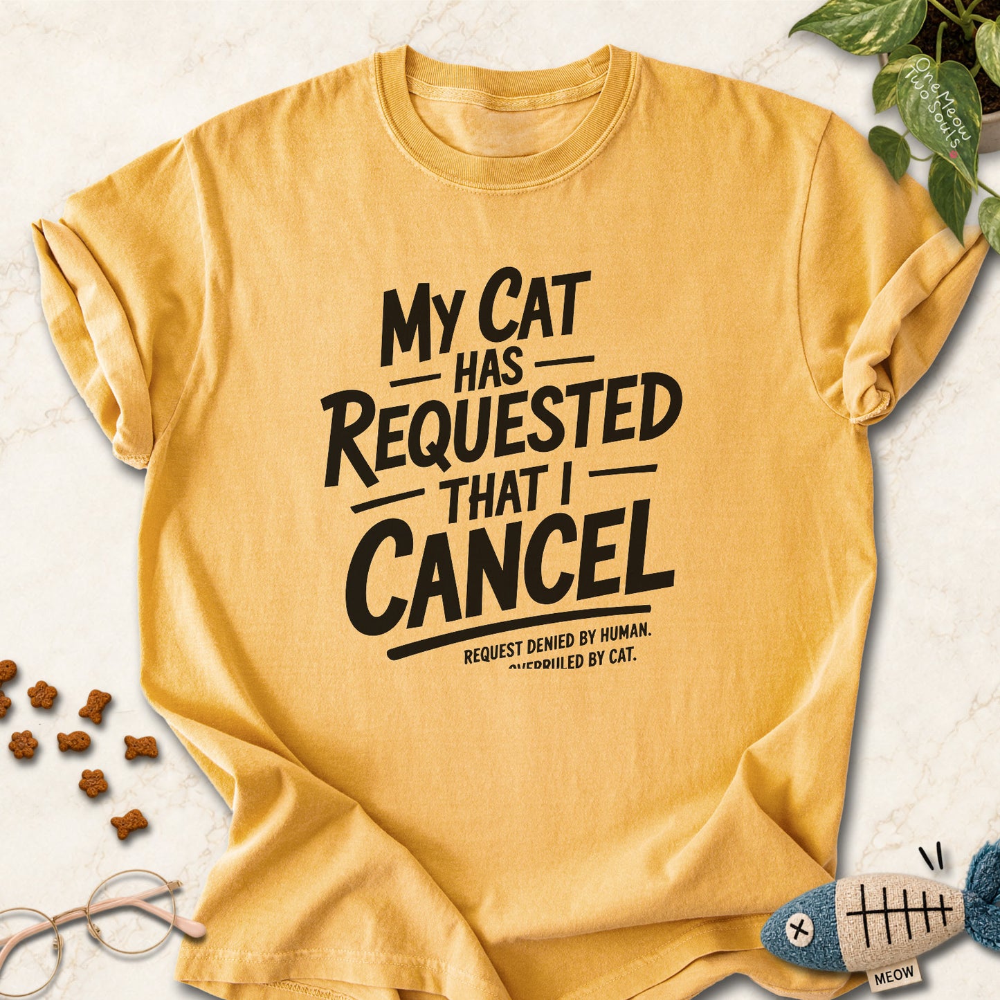 Mustard colored Comfort Colors 1717 cotton T-shirt, featuring a "My Cat Has Requested That I Cancel" funny cat design illustration. One Meow Two Souls brand.