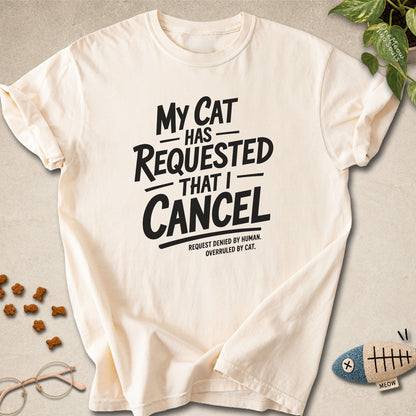 Ivory colored Comfort Colors 1717 cotton T-shirt, featuring a "My Cat Has Requested That I Cancel" funny cat design illustration. One Meow Two Souls brand.