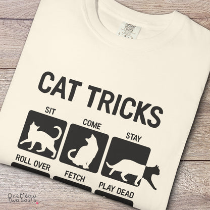 Ivory colored Comfort Colors 1717 cotton T-shirt, featuring a "Cat Tricks" funny cat design illustration. One Meow Two Souls brand.
