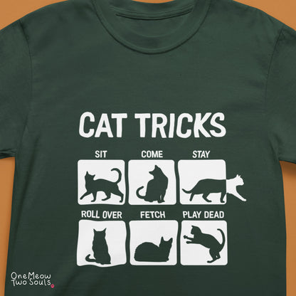 Moss colored Comfort Colors 1717 cotton T-shirt, featuring a "Cat Tricks" funny cat design illustration. One Meow Two Souls brand.