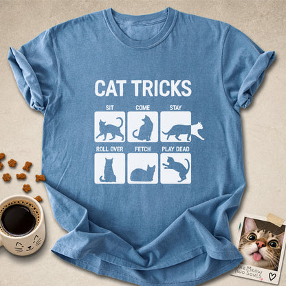 Blue jean colored Comfort Colors 1717 cotton T-shirt, featuring a "Cat Tricks" funny cat design illustration. One Meow Two Souls brand.