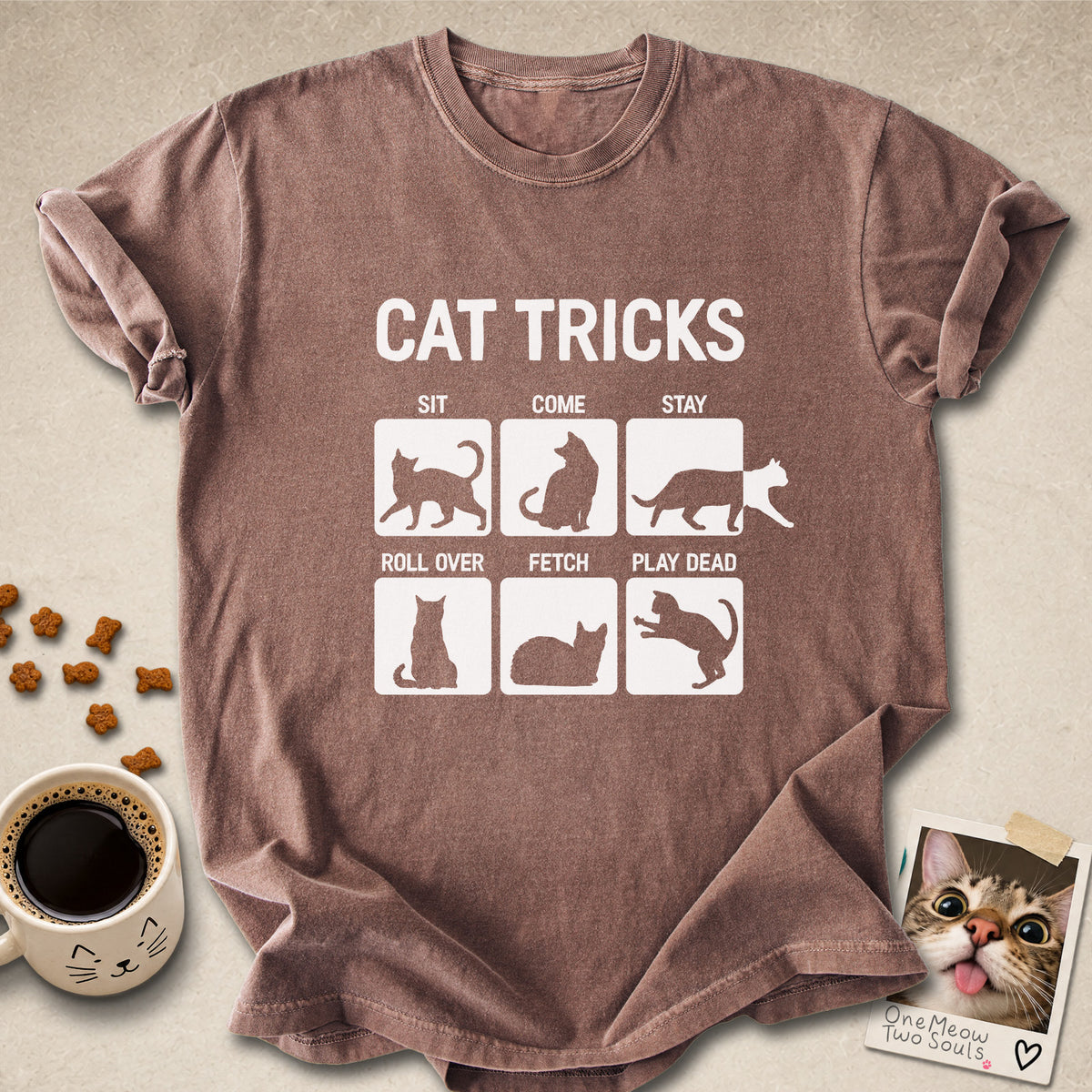 Espresso colored Comfort Colors 1717 cotton T-shirt, featuring a "Cat Tricks" funny cat design illustration. One Meow Two Souls brand.