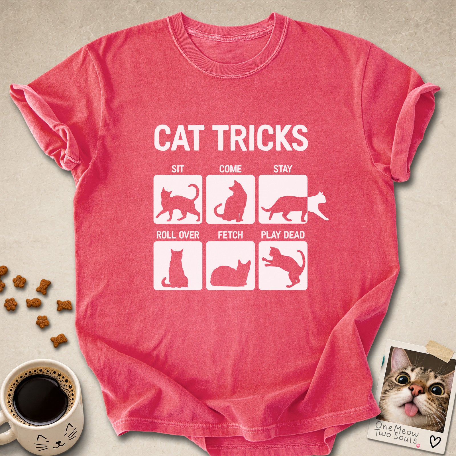 Watermelon colored Comfort Colors 1717 cotton T-shirt, featuring a "Cat Tricks" funny cat design illustration. One Meow Two Souls brand.