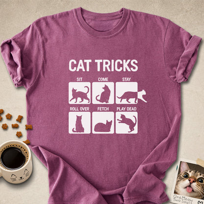 Berry colored Comfort Colors 1717 cotton T-shirt, featuring a "Cat Tricks" funny cat design illustration. One Meow Two Souls brand.