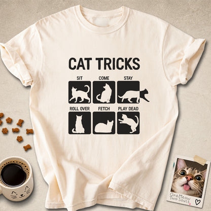 Ivory colored Comfort Colors 1717 cotton T-shirt, featuring a "Cat Tricks" funny cat design illustration. One Meow Two Souls brand.
