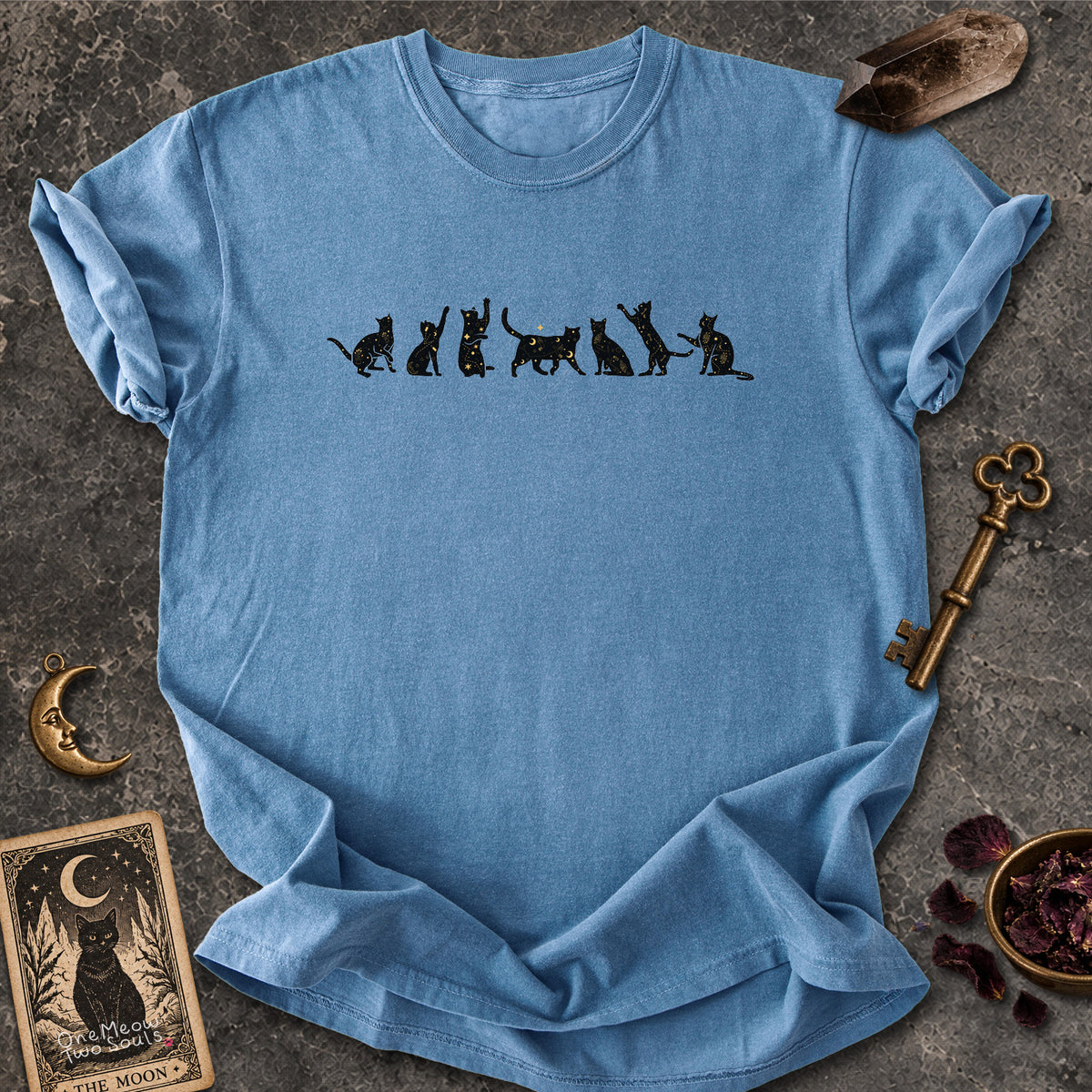 Blue Jean colored Comfort Colors 1717 cotton T-shirt, featuring a Celestial Cats witchy cat design illustration. One Meow Two Souls brand.