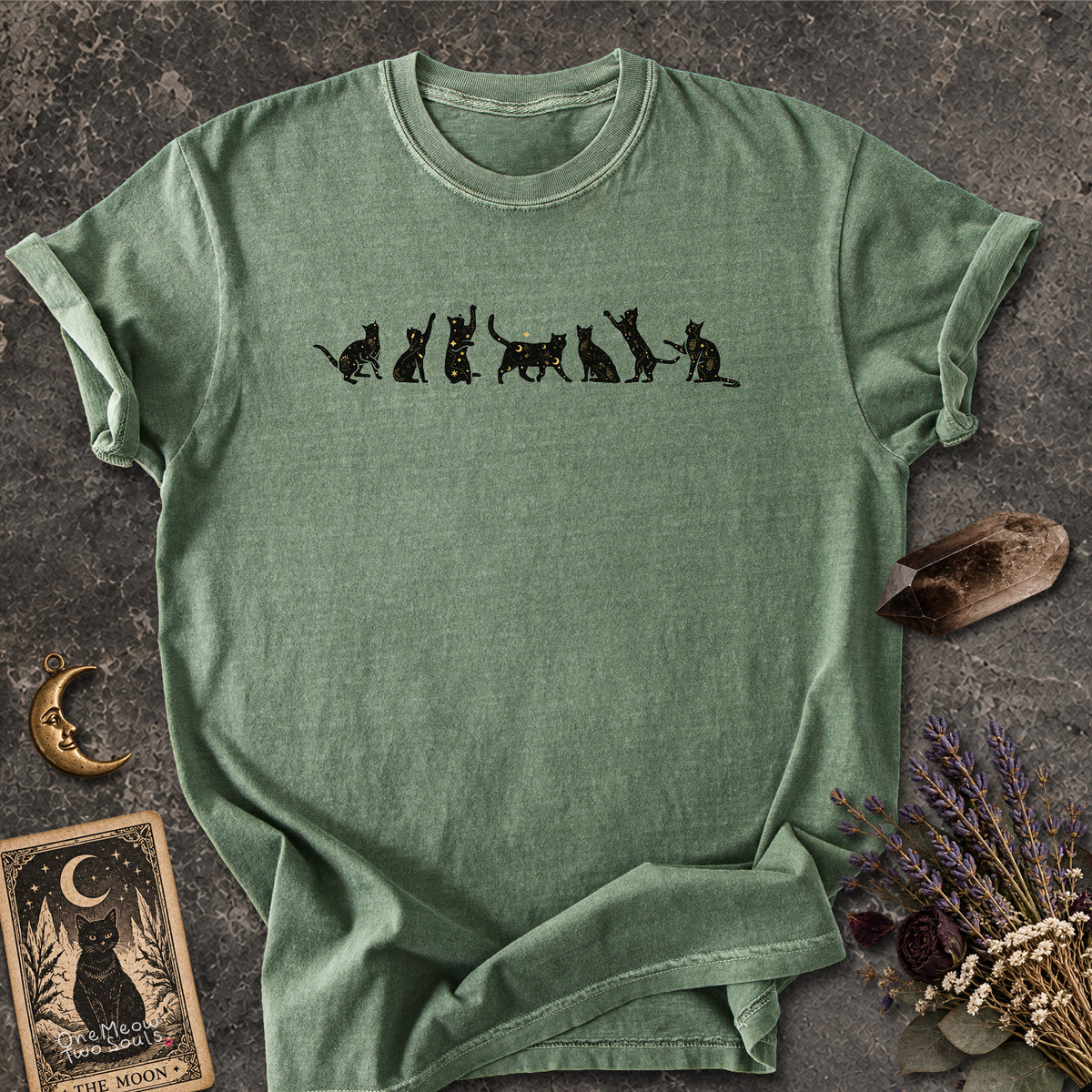 Moss colored Comfort Colors 1717 cotton T-shirt, featuring a Celestial Cats witchy cat design illustration. One Meow Two Souls brand.