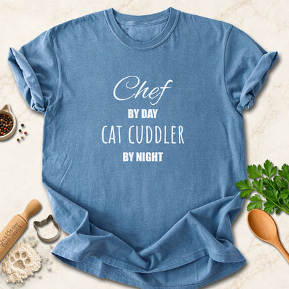 Blue Jean colored Comfort Colors 1717 cotton T-shirt, featuring a "Chef by day, cat cuddler by night" funny cat design illustration. One Meow Two Souls brand.