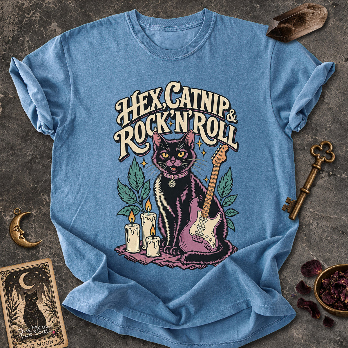 Blue Jean colored Comfort Colors 1717 cotton T-shirt, featuring a "Hex, catnip and Rock n roll" gothic witchy cat design illustration. One Meow Two Souls brand.