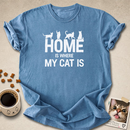 Blue jean colored Comfort Colors 1717 cotton T-shirt, featuring a "Home is Where My Cat Is" funny cat design illustration. One Meow Two Souls brand.