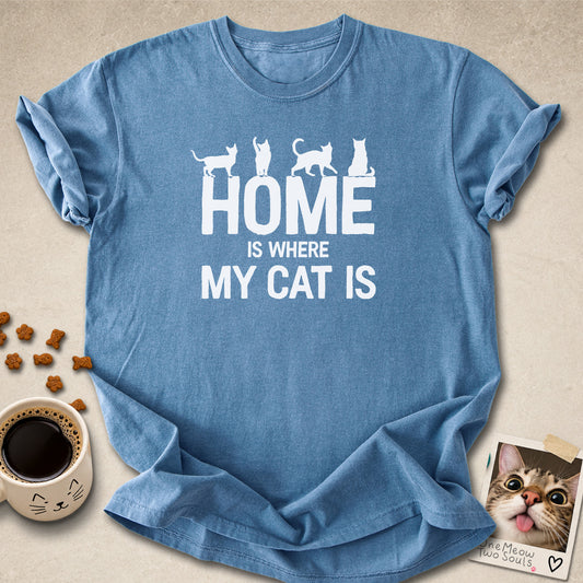 Blue jean colored Comfort Colors 1717 cotton T-shirt, featuring a "Home is Where My Cat Is" funny cat design illustration. One Meow Two Souls brand.