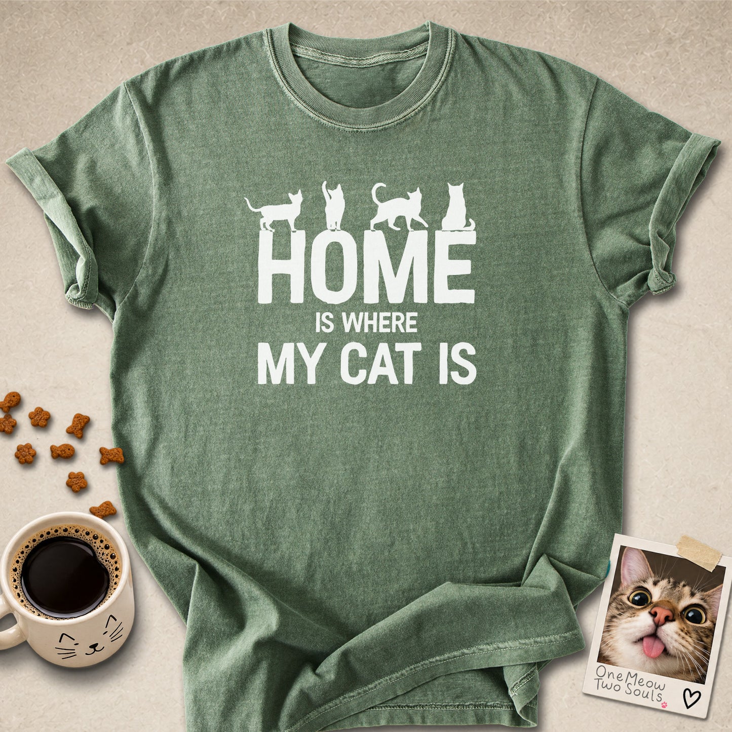 Moss colored Comfort Colors 1717 cotton T-shirt, featuring a "Home is Where My Cat Is" funny cat design illustration. One Meow Two Souls brand.