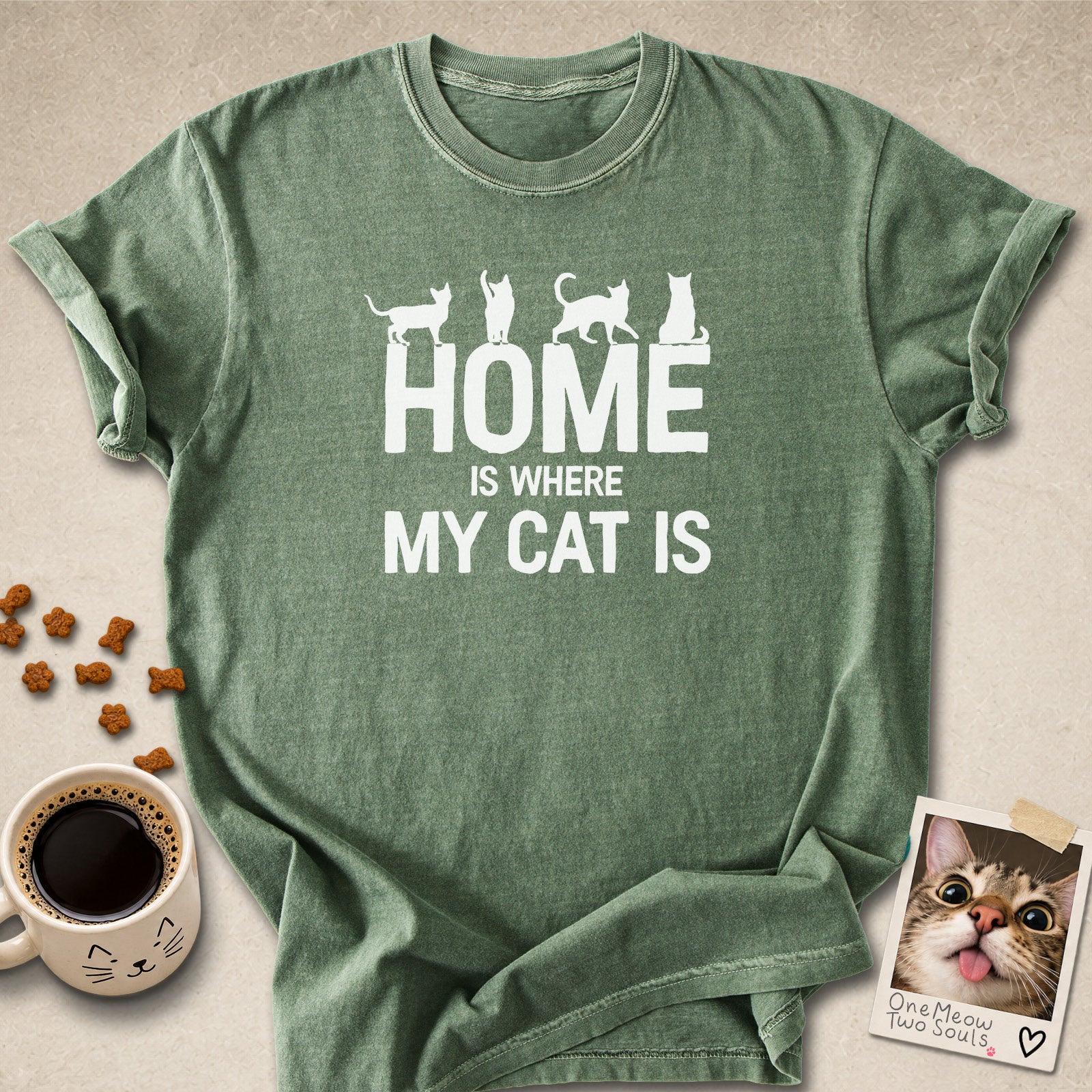 Moss colored Comfort Colors 1717 cotton T-shirt, featuring a "Home is Where My Cat Is" funny cat design illustration. One Meow Two Souls brand.