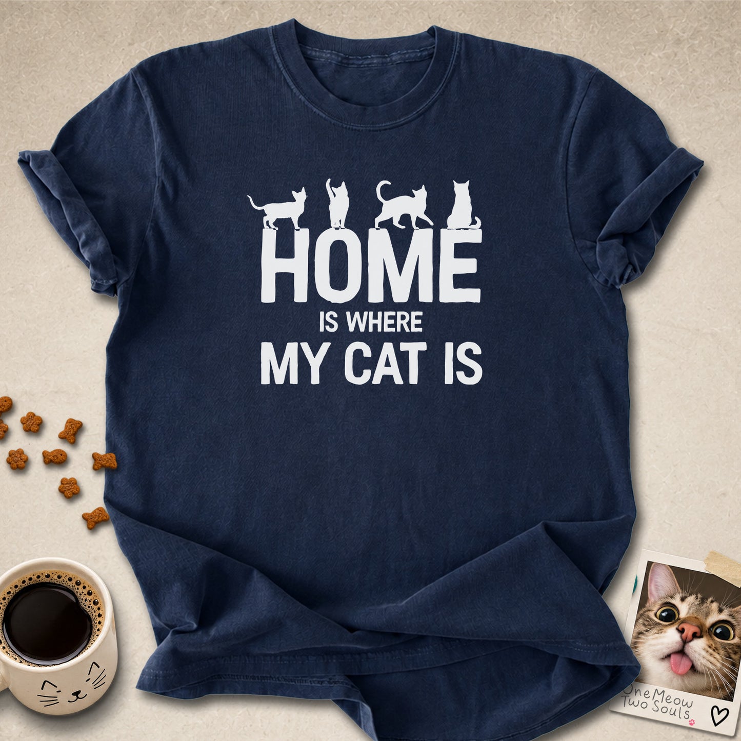 Navy colored Comfort Colors 1717 cotton T-shirt, featuring a "Home is Where My Cat Is" funny cat design illustration. One Meow Two Souls brand.