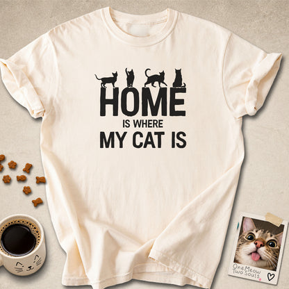 Ivory colored Comfort Colors 1717 cotton T-shirt, featuring a "Home is Where My Cat Is" funny cat design illustration. One Meow Two Souls brand.