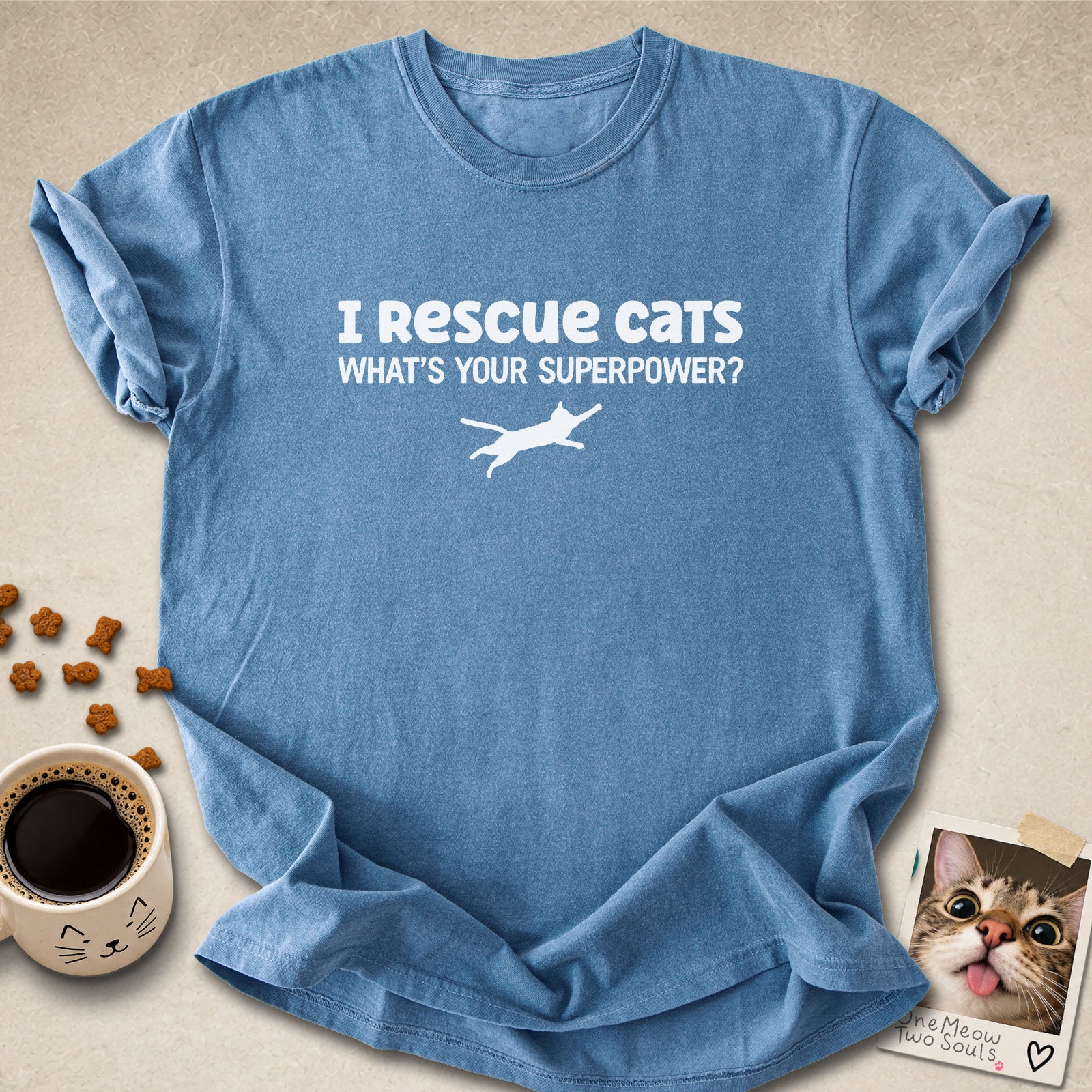 Blue jean colored Comfort Colors 1717 cotton T-shirt, featuring a "I Rescue cats. What is your superpower?" funny cat design illustration. One Meow Two Souls brand.