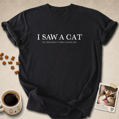 Black colored Comfort Colors 1717 cotton T-shirt, featuring a "I saw a cat. So obviously it was a good day." funny cat design illustration. One Meow Two Souls brand.