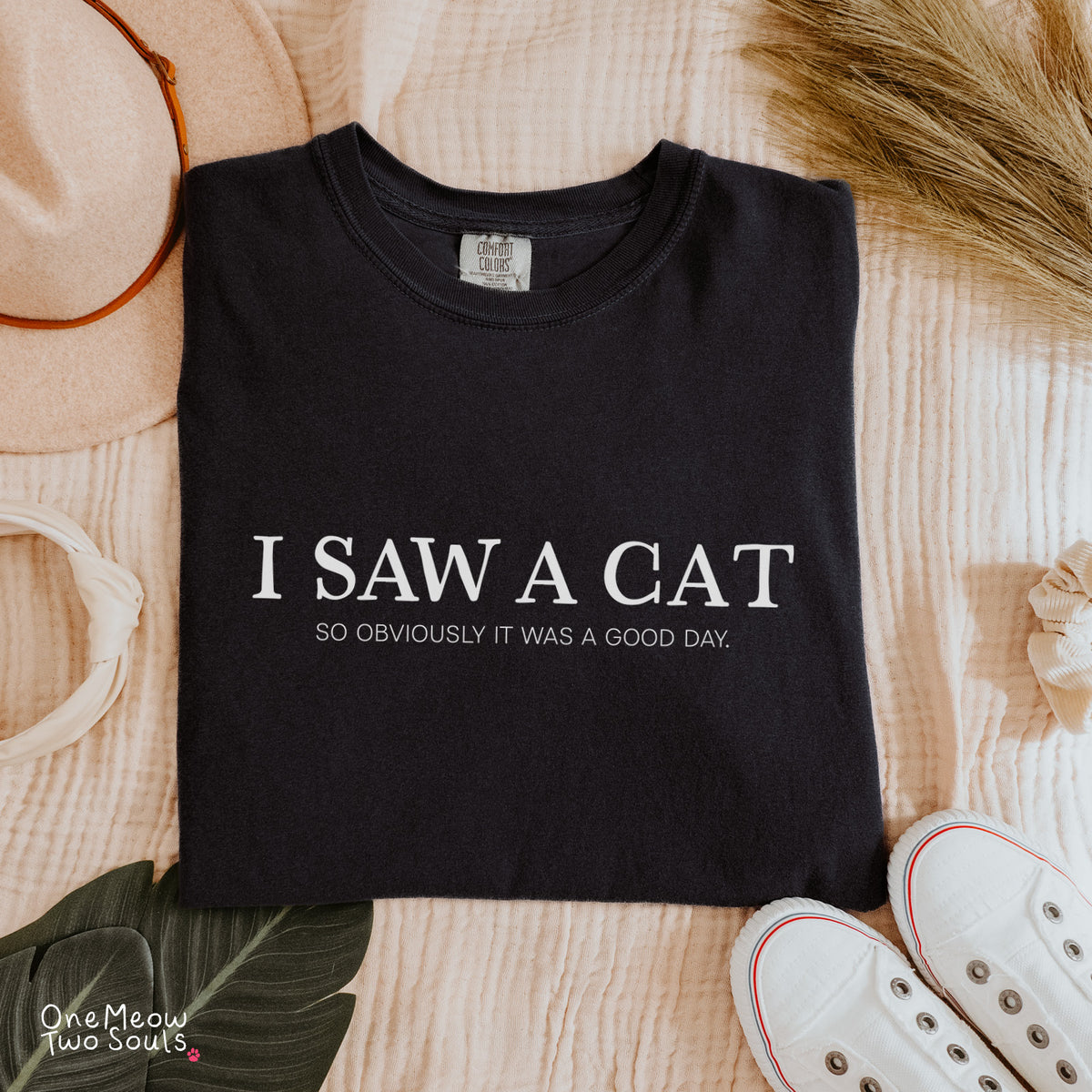 Black colored Comfort Colors 1717 cotton T-shirt, featuring a "I saw a cat. So obviously it was a good day." funny cat design illustration. One Meow Two Souls brand.