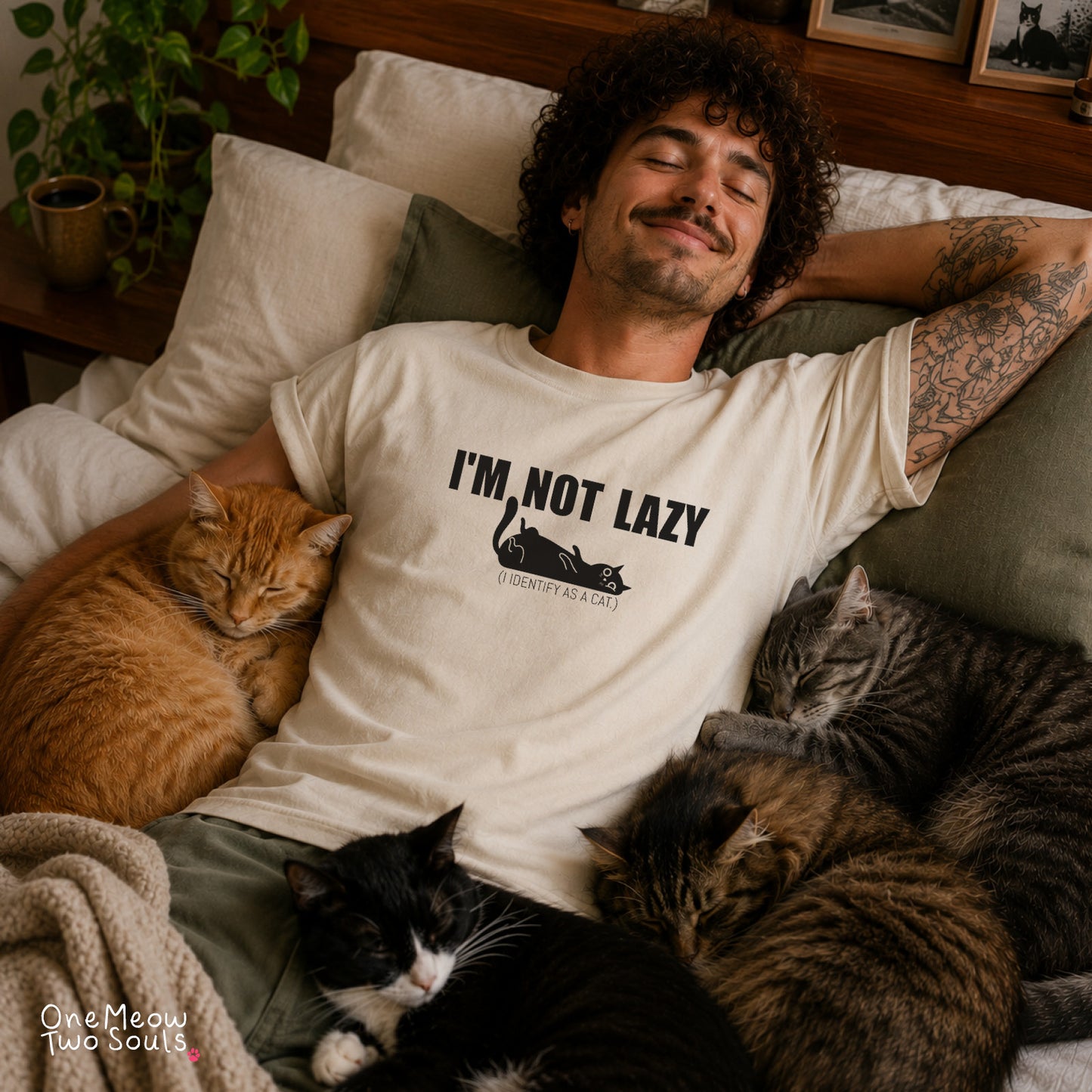 Ivory colored Comfort Colors 1717 cotton T-shirt, featuring a "I'm not lazy, I identify as a cat" funny cat design illustration. One Meow Two Souls brand.