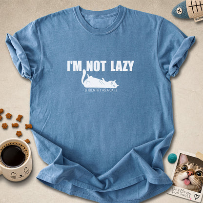 Blue Jean colored Comfort Colors 1717 cotton T-shirt, featuring a "I'm not lazy, I identify as a cat" funny cat design illustration. One Meow Two Souls brand.