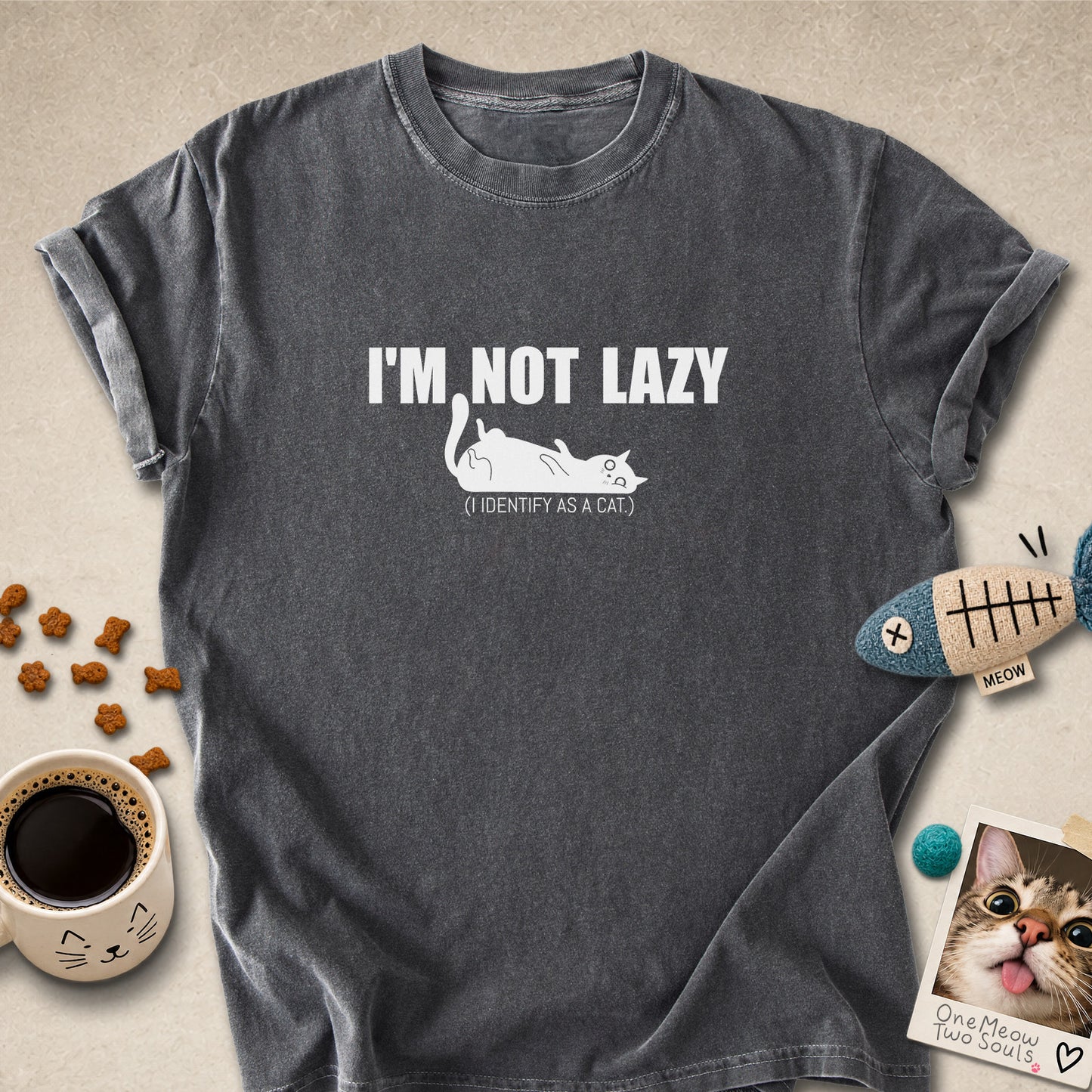 Pepper colored Comfort Colors 1717 cotton T-shirt, featuring a "I'm not lazy, I identify as a cat" funny cat design illustration. One Meow Two Souls brand.