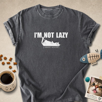 Pepper colored Comfort Colors 1717 cotton T-shirt, featuring a "I'm not lazy, I identify as a cat" funny cat design illustration. One Meow Two Souls brand.