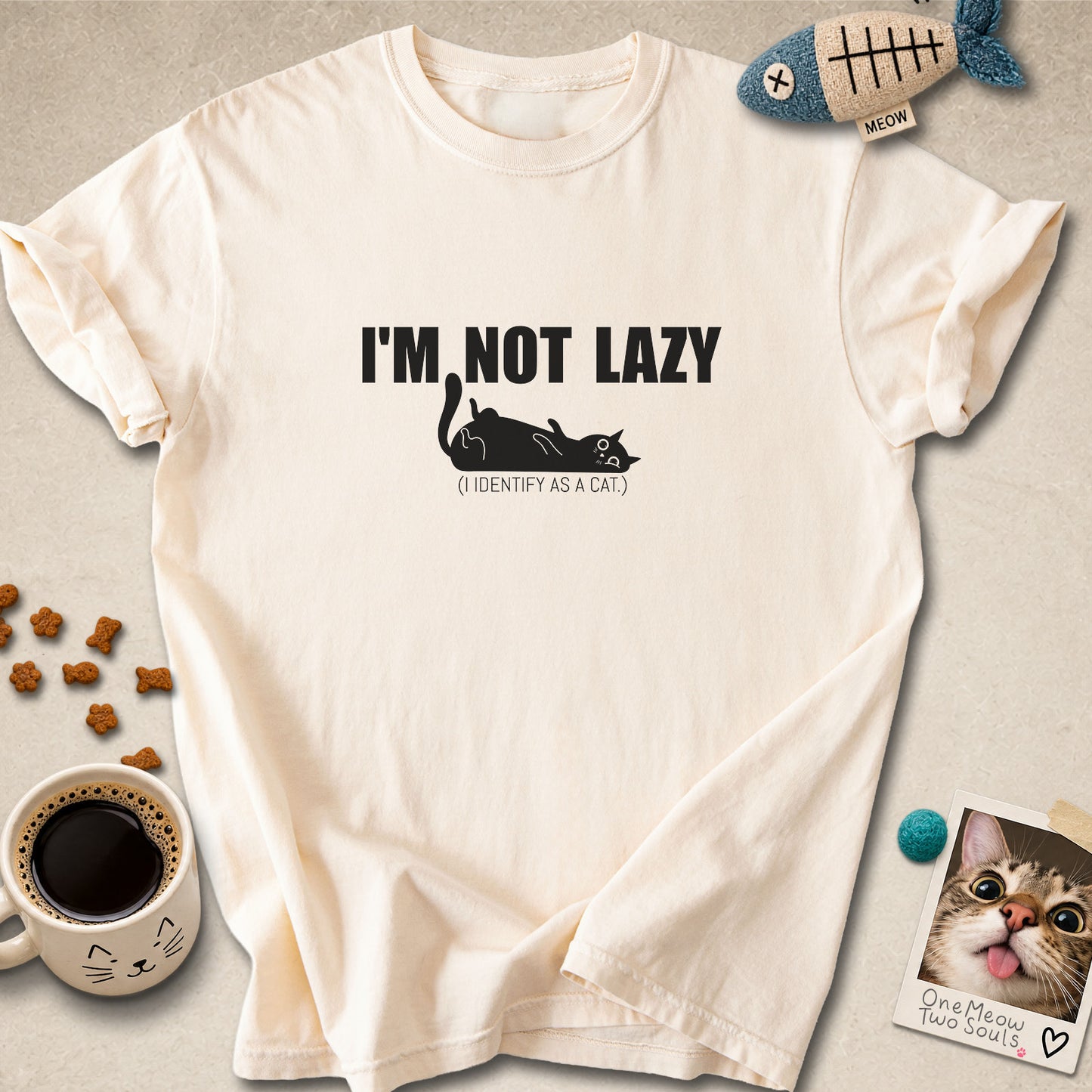 Ivory colored Comfort Colors 1717 cotton T-shirt, featuring a "I'm not lazy, I identify as a cat" funny cat design illustration. One Meow Two Souls brand.
