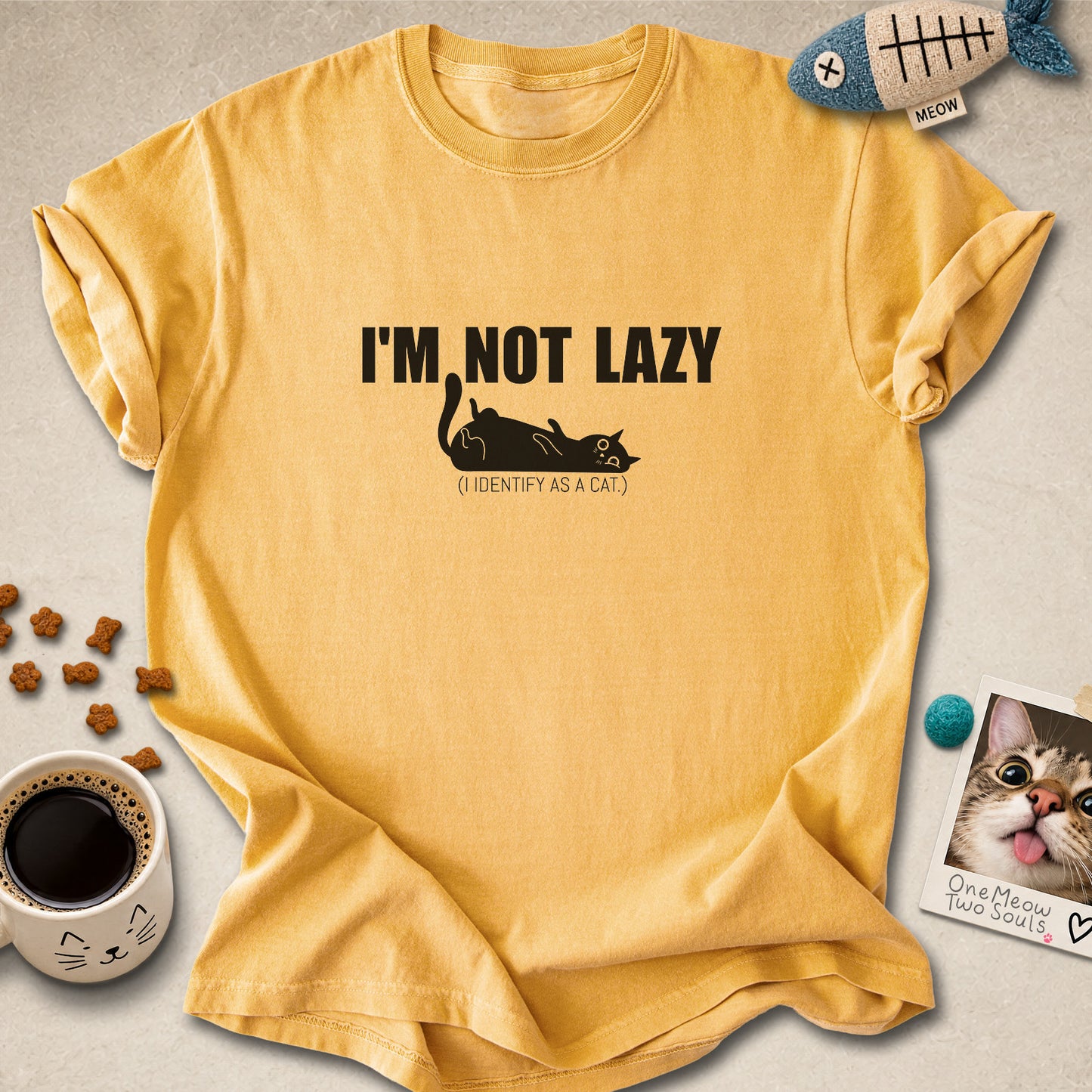 Mustard colored Comfort Colors 1717 cotton T-shirt, featuring a "I'm not lazy, I identify as a cat" funny cat design illustration. One Meow Two Souls brand.