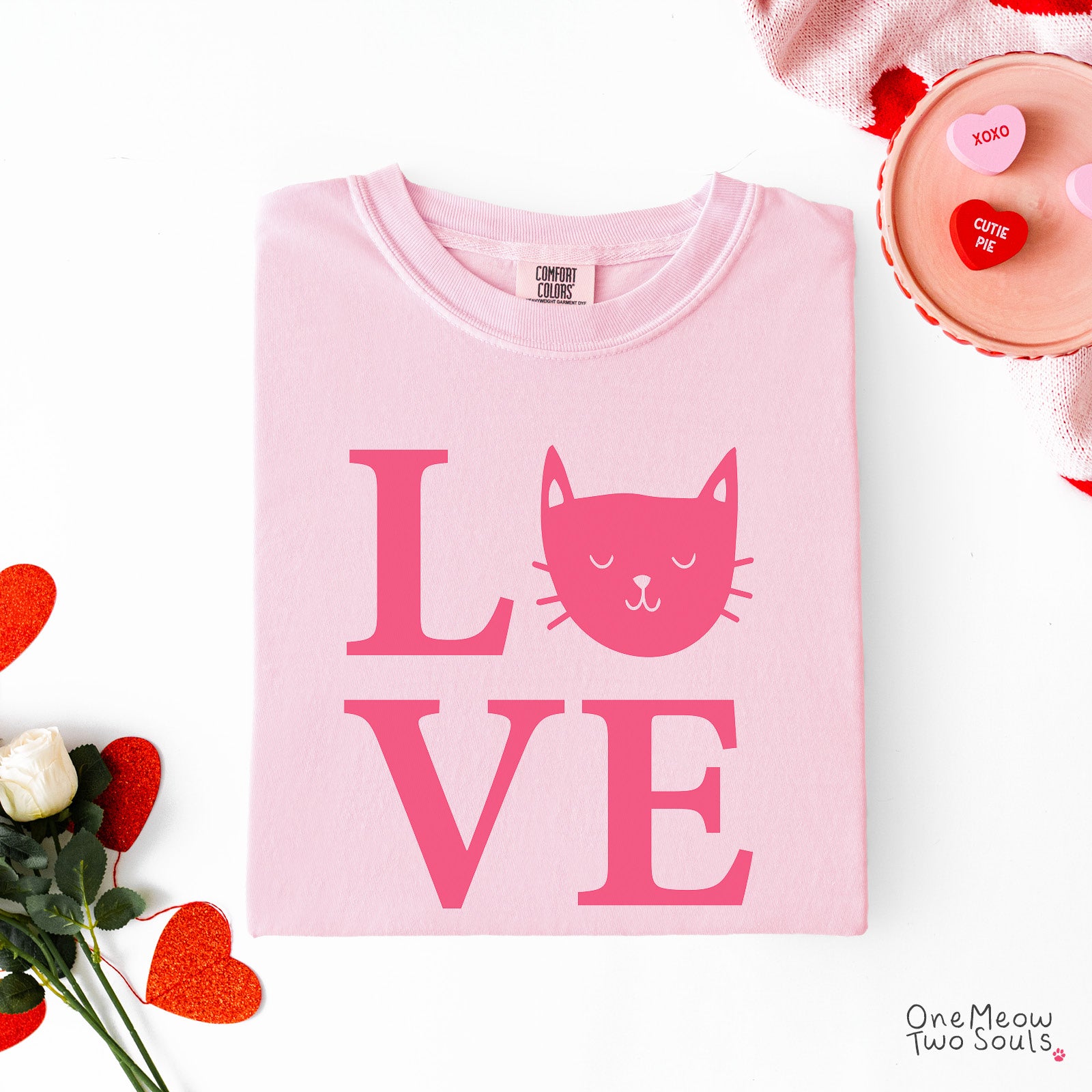 Blossom colored Comfort Colors 1717 cotton T-shirt, featuring a "LOVE" cute cat design illustration. One Meow Two Souls brand.