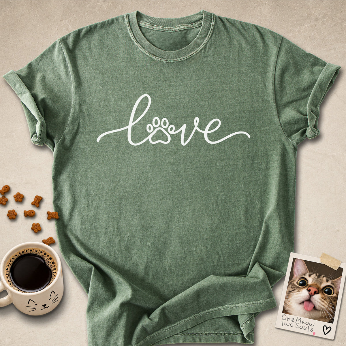 Moss colored Comfort Colors 1717 cotton T-shirt, featuring a "LOVE" cat paw design illustration. One Meow Two Souls brand.