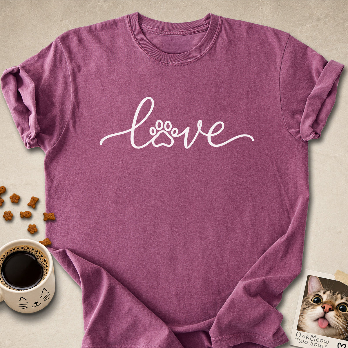 Berry colored Comfort Colors 1717 cotton T-shirt, featuring a "LOVE" cat paw design illustration. One Meow Two Souls brand.