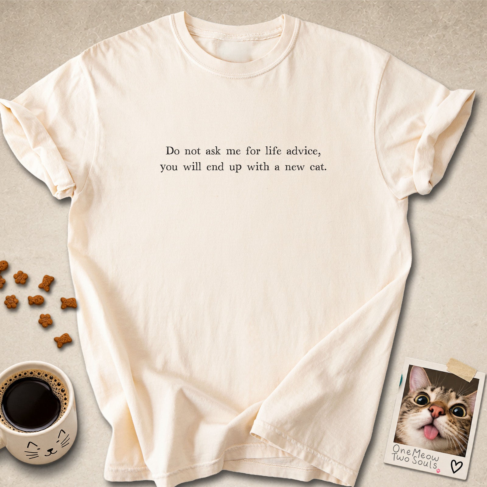 Ivory colored Comfort Colors 1717 cotton T-shirt, featuring a "Do not ask me for life advice, you will end up with a new cat." funny cat design illustration. One Meow Two Souls brand.