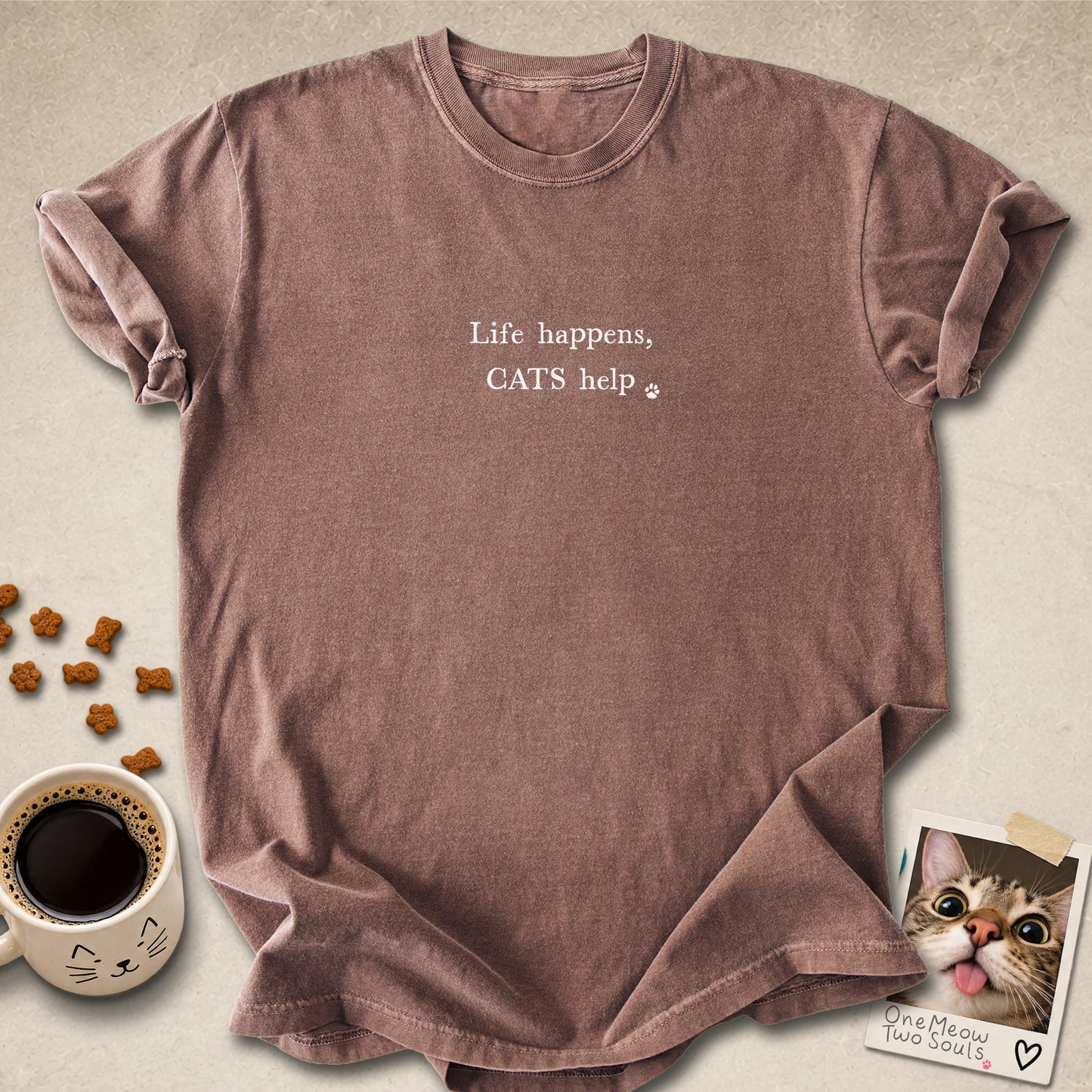 Espresso colored Comfort Colors 1717 cotton T-shirt, featuring a "Life happens, cats help" funny cat design illustration. One Meow Two Souls brand.