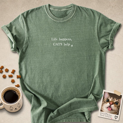 Moss colored Comfort Colors 1717 cotton T-shirt, featuring a "Life happens, cats help" funny cat design illustration. One Meow Two Souls brand.