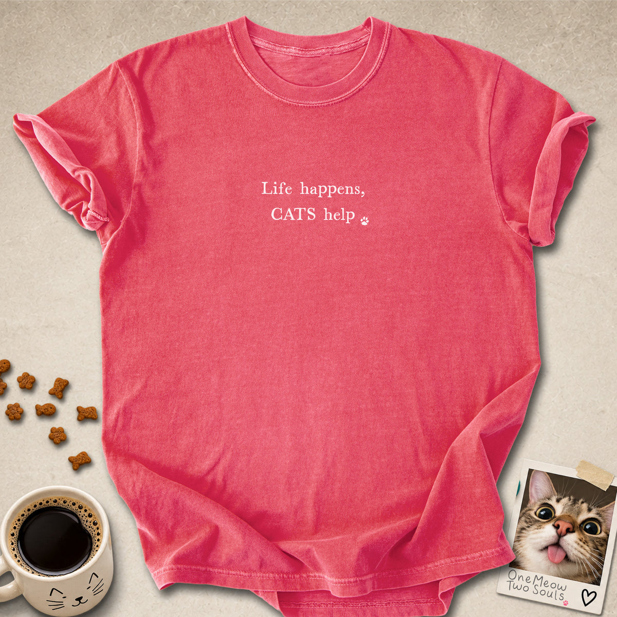Watermelon colored Comfort Colors 1717 cotton T-shirt, featuring a "Life happens, cats help" funny cat design illustration. One Meow Two Souls brand.