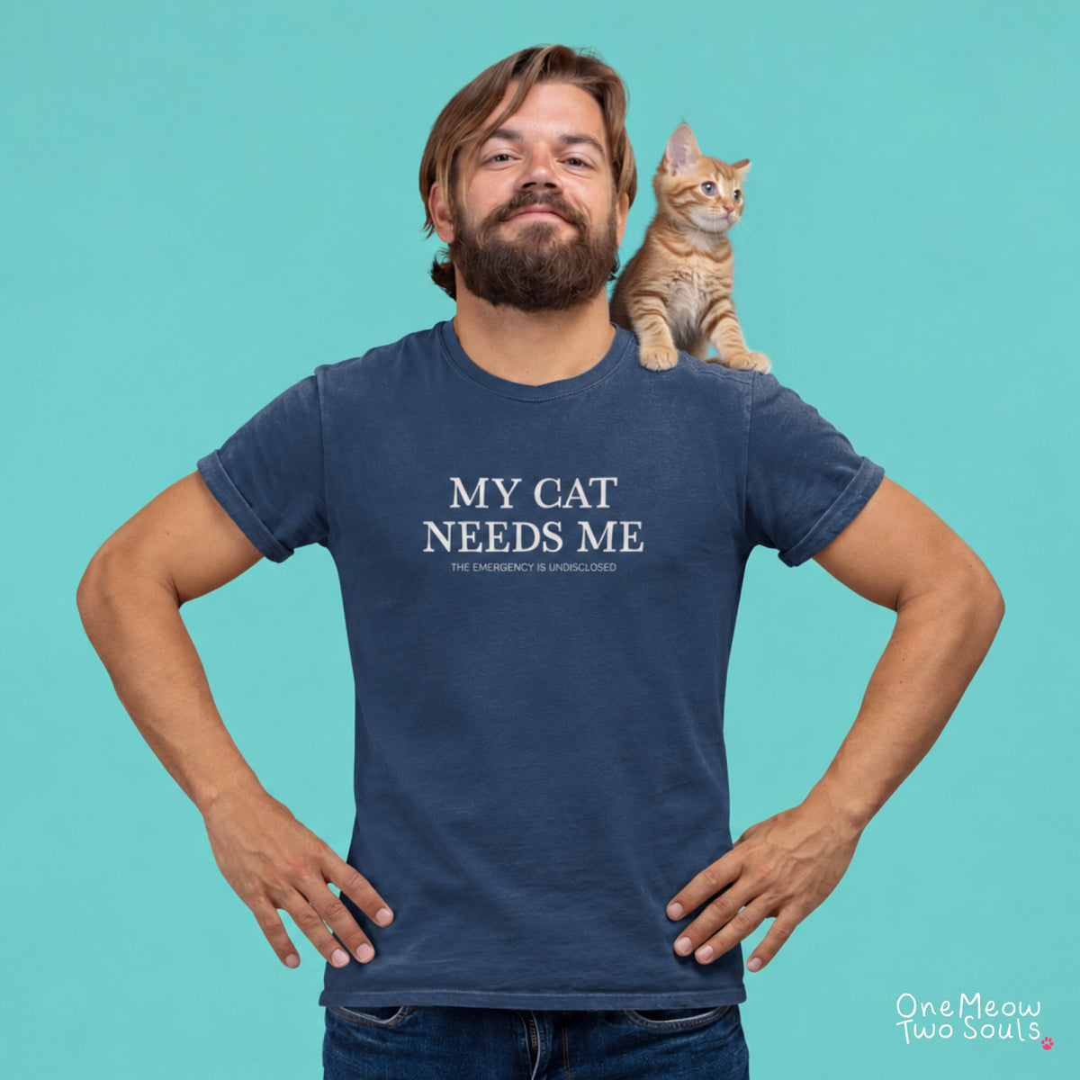 Navy colored Comfort Colors 1717 cotton T-shirt, featuring a "My Cat Needs Me. The Emergency is Undisclosed" funny cat design illustration. One Meow Two Souls brand.