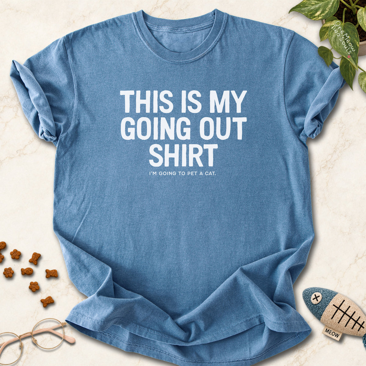 Blue Jean colored Comfort Colors 1717 cotton T-shirt, featuring a "This Is My Going Out Shirt. I Am Going To Pet A Cat" funny cat design illustration. One Meow Two Souls brand.