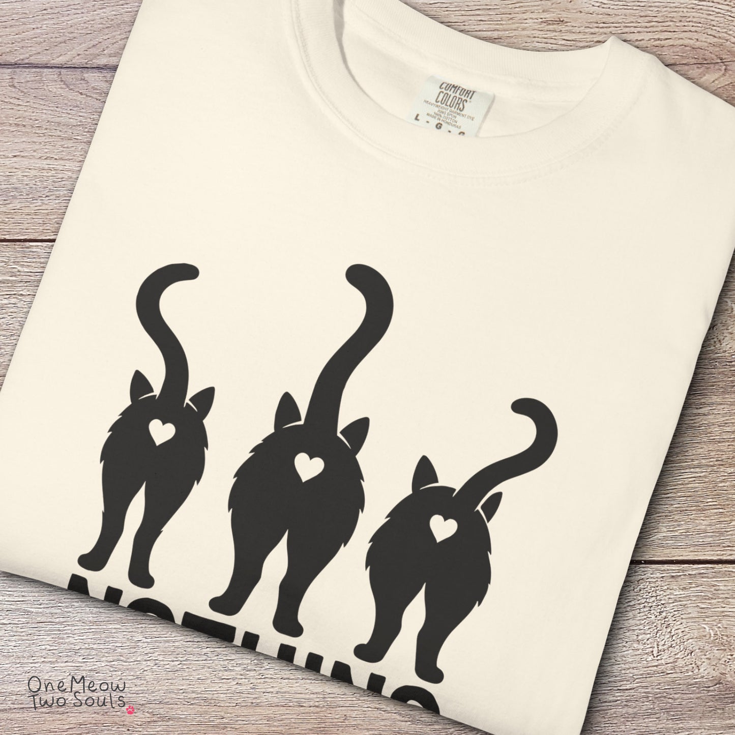 Ivory colored Comfort Colors 1717 cotton T-shirt, featuring a "Nothing Butt Cats" funny cat design illustration. One Meow Two Souls brand.