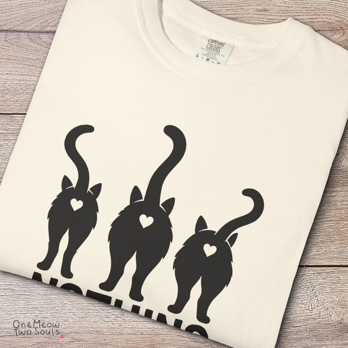 Ivory colored Comfort Colors 1717 cotton T-shirt, featuring a "Nothing Butt Cats" funny cat design illustration. One Meow Two Souls brand.