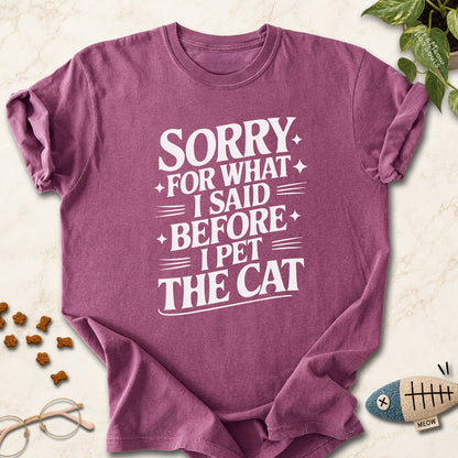 Berry colored Comfort Colors 1717 cotton T-shirt, featuring a "Sorry for what I said before I pet the cat" funny cat design illustration. One Meow Two Souls brand.