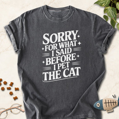Pepper colored Comfort Colors 1717 cotton T-shirt, featuring a "Sorry for what I said before I pet the cat" funny cat design illustration. One Meow Two Souls brand.