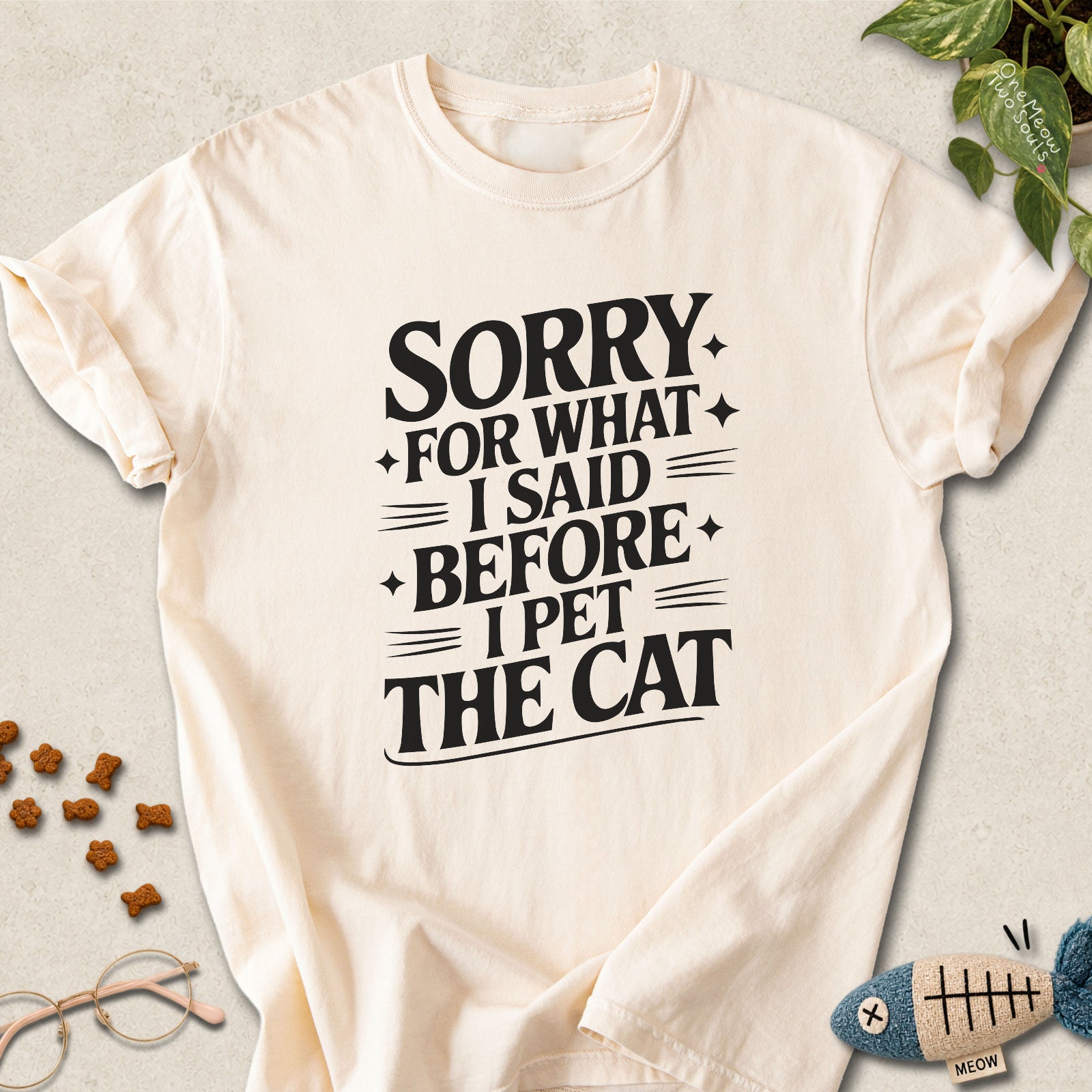 Ivory colored Comfort Colors 1717 cotton T-shirt, featuring a "Sorry for what I said before I pet the cat" funny cat design illustration. One Meow Two Souls brand.