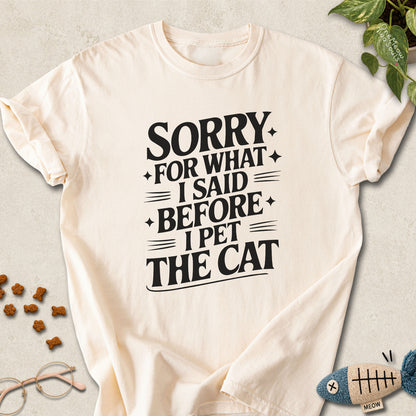 Ivory colored Comfort Colors 1717 cotton T-shirt, featuring a "Sorry for what I said before I pet the cat" funny cat design illustration. One Meow Two Souls brand.