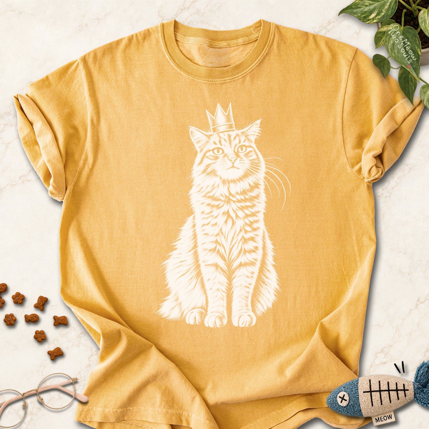Mustard colored Comfort Colors 1717 cotton T-shirt, featuring a royal king cat design illustration. One Meow Two Souls brand.