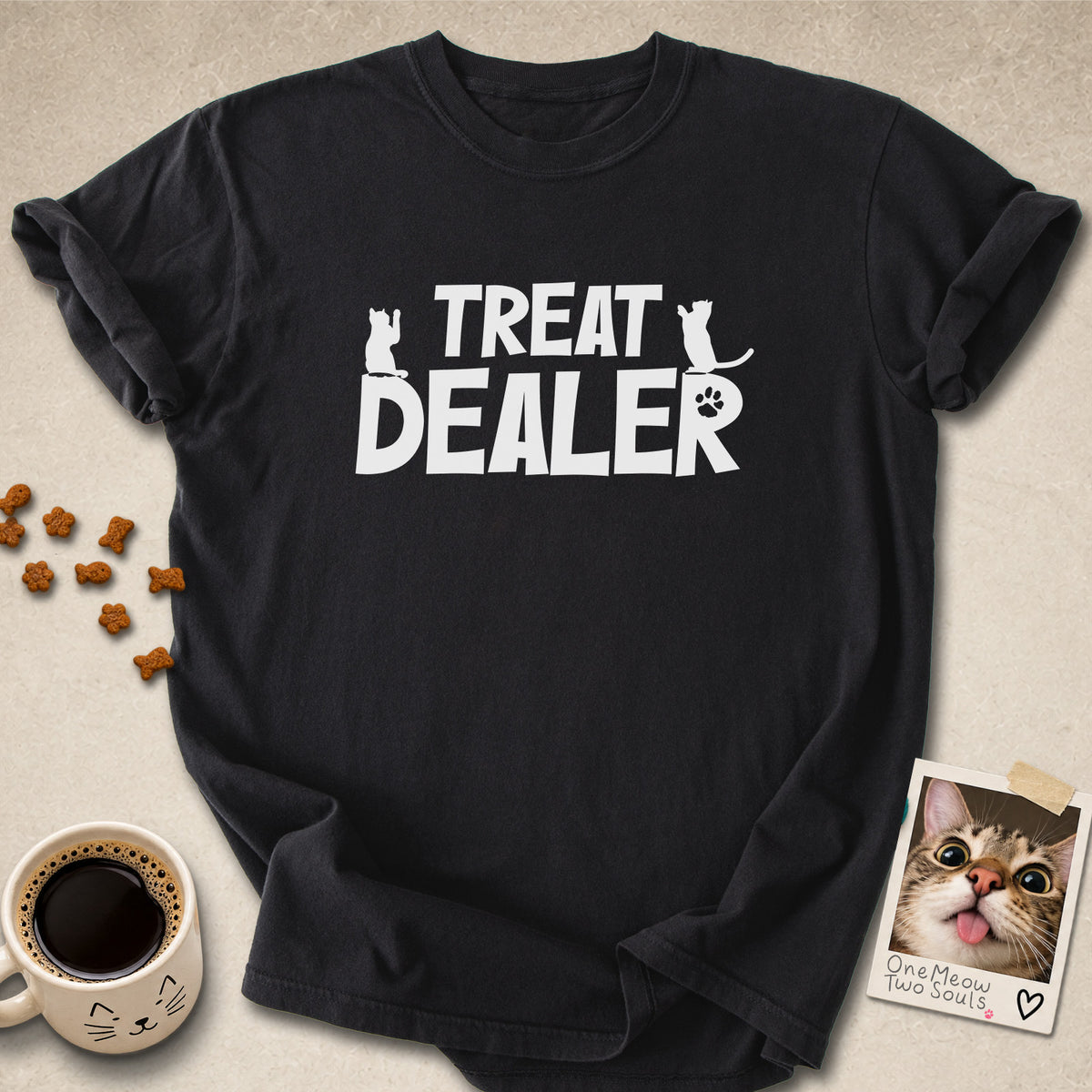 Black colored Comfort Colors 1717 cotton T-shirt, featuring a "Treat Dealer" funny cat design illustration. One Meow Two Souls brand.
