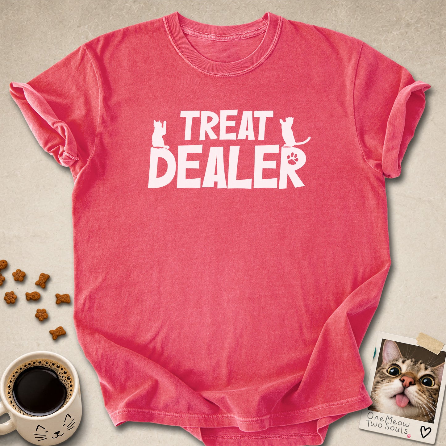 Watermelon colored Comfort Colors 1717 cotton T-shirt, featuring a "Treat Dealer" funny cat design illustration. One Meow Two Souls brand.