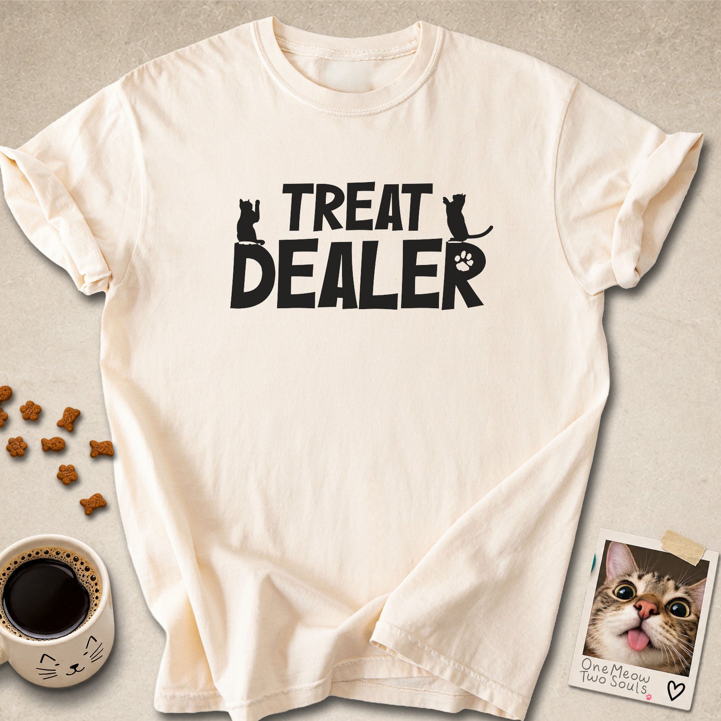 Ivory colored Comfort Colors 1717 cotton T-shirt, featuring a "Treat Dealer" funny cat design illustration. One Meow Two Souls brand.