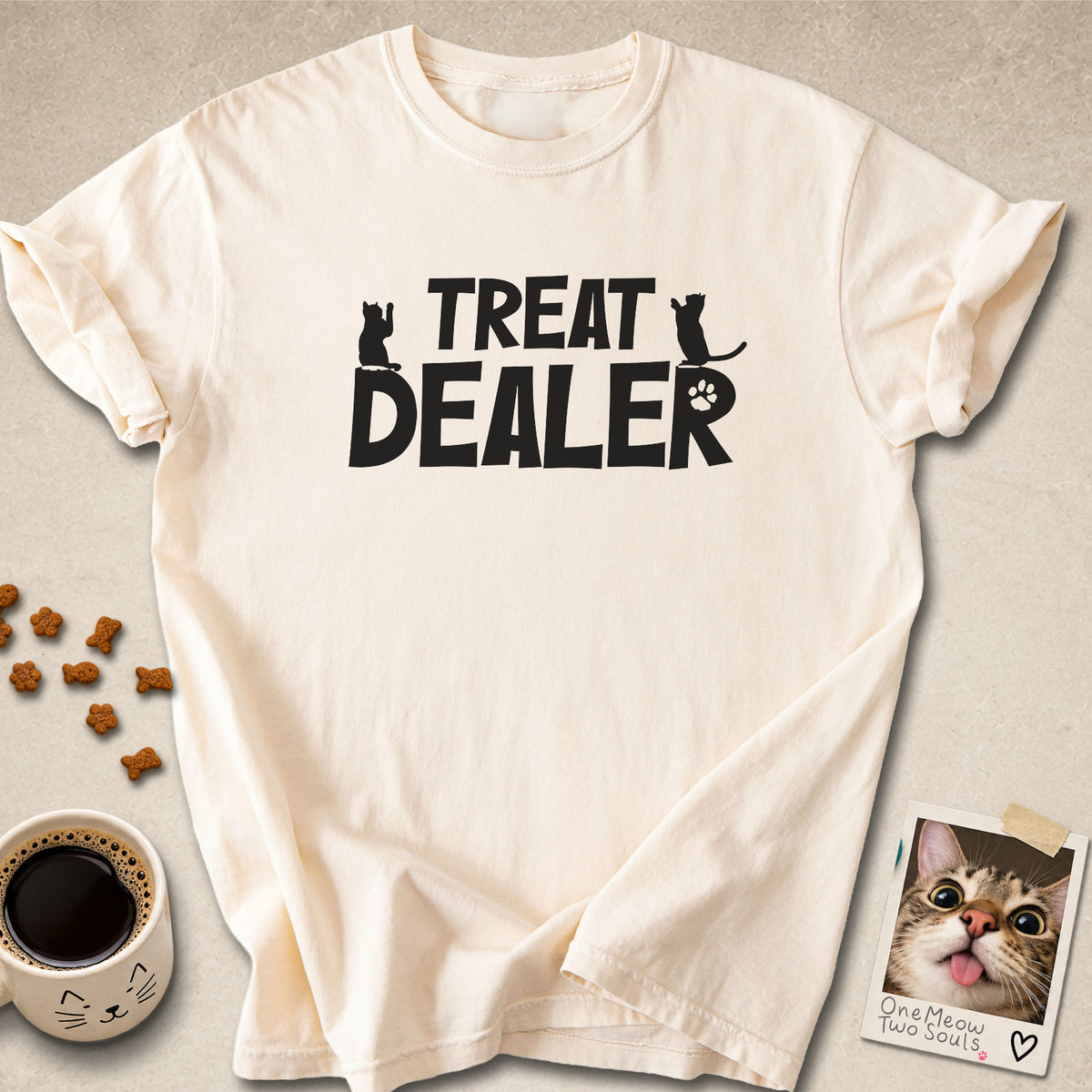 Ivory colored Comfort Colors 1717 cotton T-shirt, featuring a "Treat Dealer" funny cat design illustration. One Meow Two Souls brand.