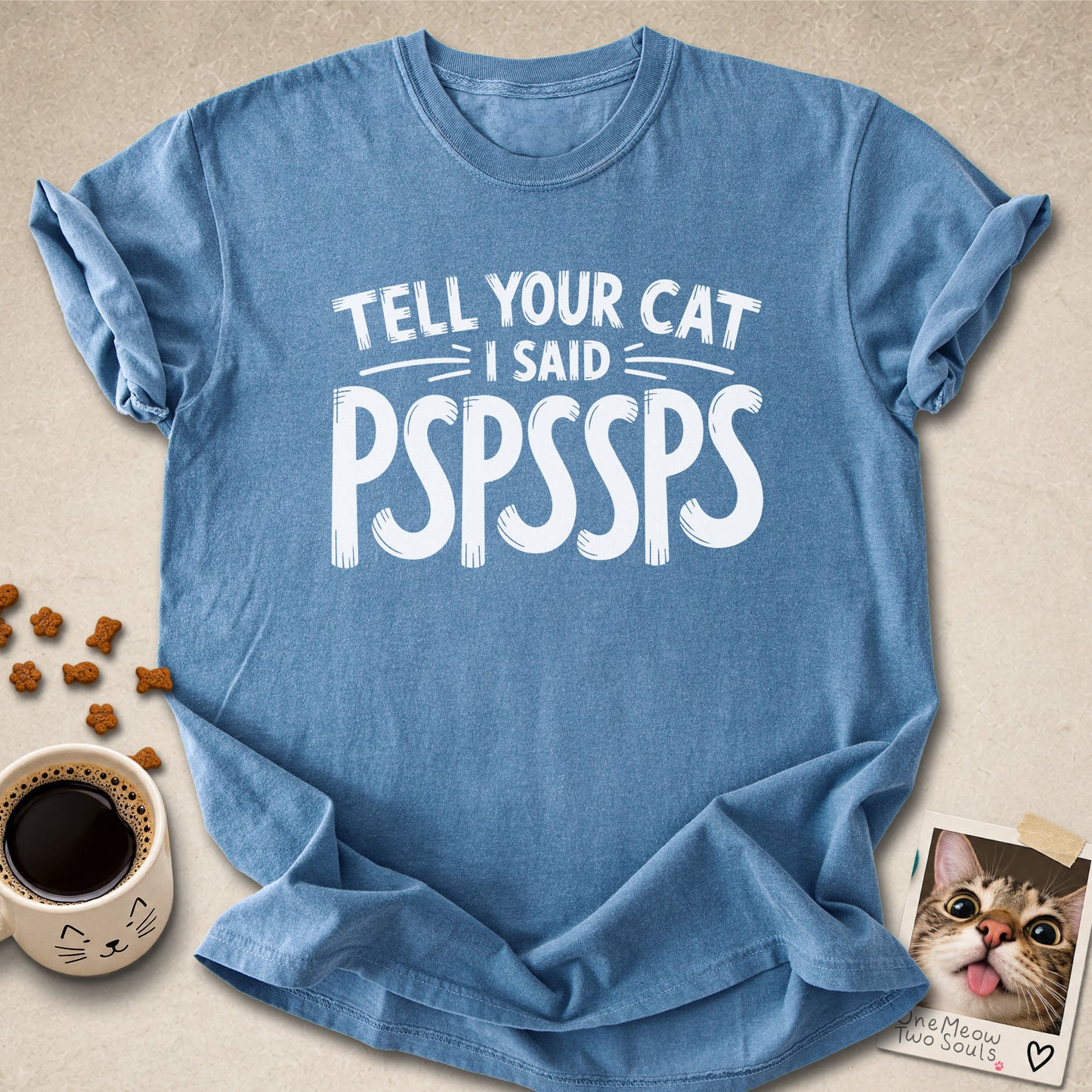 Blue jean colored Comfort Colors 1717 cotton T-shirt, featuring a "Tell your cat I said Pspssps" funny cat design illustration. One Meow Two Souls brand.