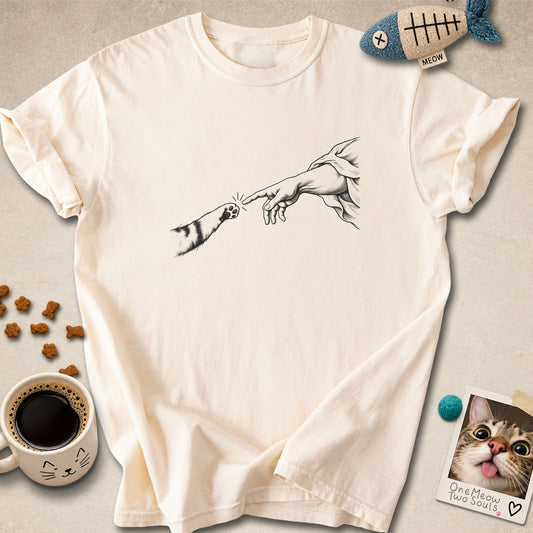 Ivory colored Comfort Colors 1717 cotton T-shirt, featuring a "The Creation Of Cat" funny cat design illustration. One Meow Two Souls brand.